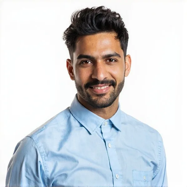 Indian male fantasy cricket tipster professional headshot on a pale lilac background, light blue shirt